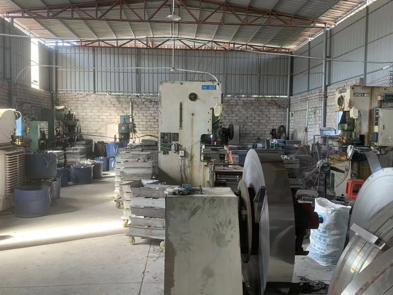 Actual YIYING workshop with metalworking equipment and trays