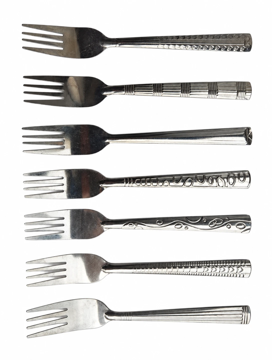 Series 05 No. 3 Tea Fork: seven real stainless steel tea fork handle styles photographed on white